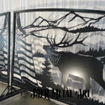 Driveway gates with plasma cut mountains, elk, bear and American flag.