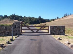 Single swing driveway gate idea, design has a V shaped support in the center of rectangular tubing design.