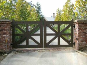 Metal driveway gate design idea with square frames and cross supports.