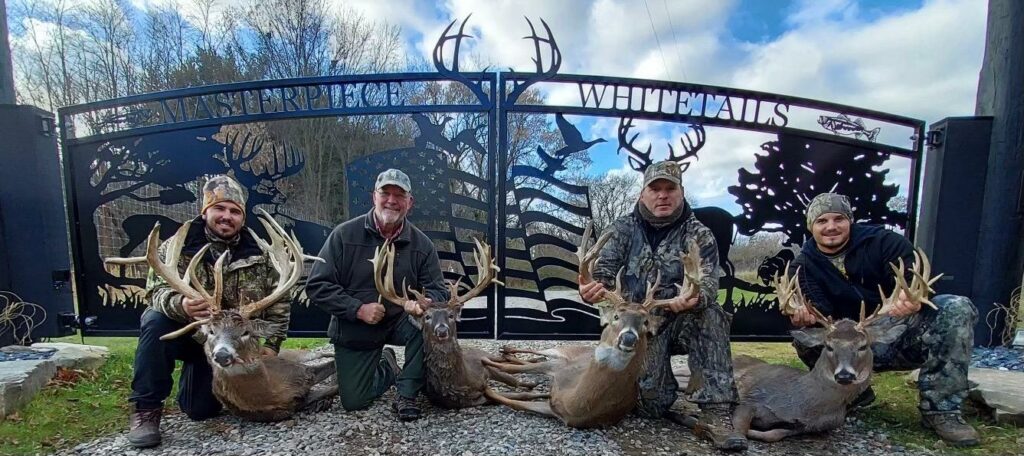 Wildlife Driveway Gates - custom Plasma Cut Wildlife Designs & Wild animal designs 1 This driveway gate features wildlife, wild animals including deer, turkey, ducks, trees, and American flag, four hunters, with an arched driveway gate hanging from large columns about 20' wide.