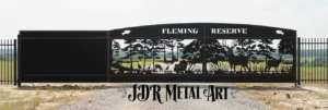 Slide-Driveway-Gate-Southern-Georgia-Fleming-Reserve 1 Custom 36-foot cantilever slide driveway gate for Fleming Reserve near Nicholls, Georgia, featuring wildlife metal art and a black powder-coated finish.