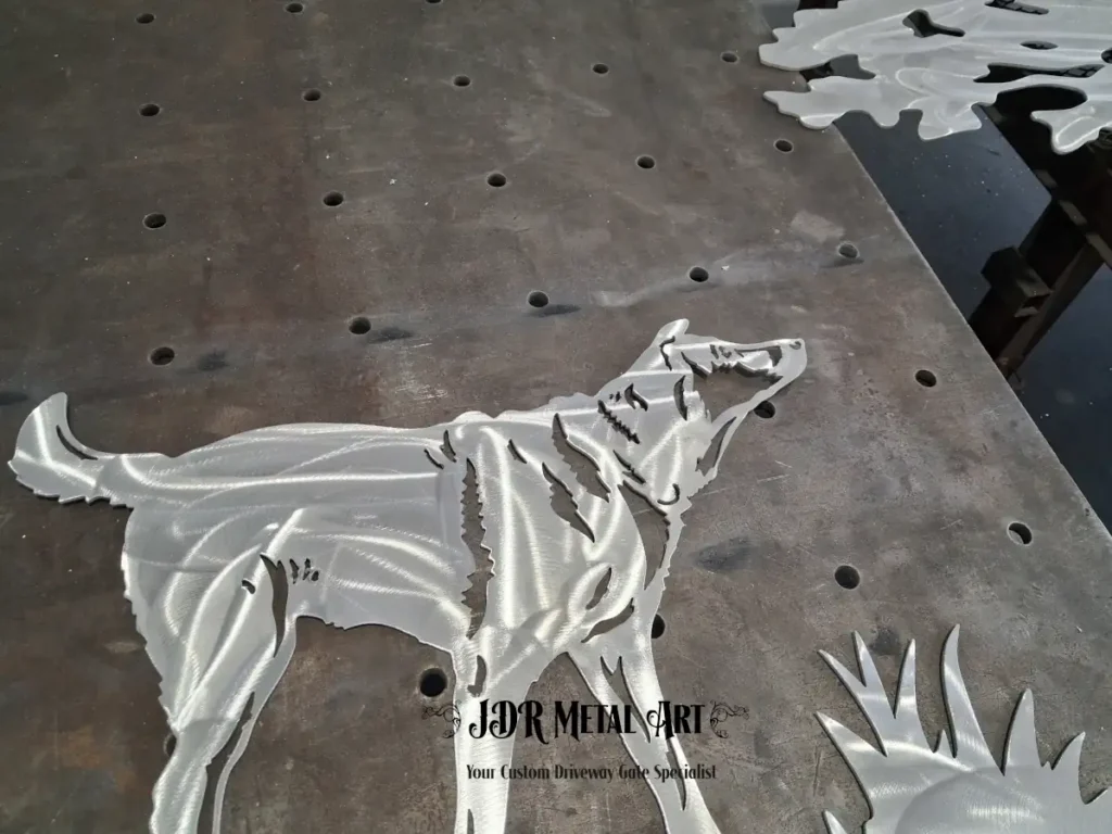 Tampa Bay Custom Aluminum Driveway Gate Fabricator | JDR Metal Art 2 Custom aluminum driveway gate fabricator in Tampa Bay cutting a dog silhouette artwork panel